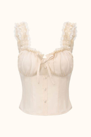 A front view of an ivory corset-style top featuring ruffled lace straps, soft gathered bust detailing, front buttons, and a structured silhouette.