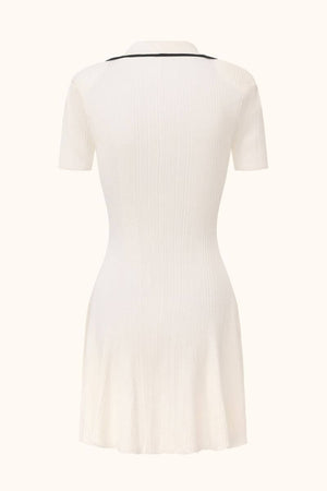 Back view of a white ribbed knit mini dress featuring short sleeves, black collar trim, and a clean, fitted back design.