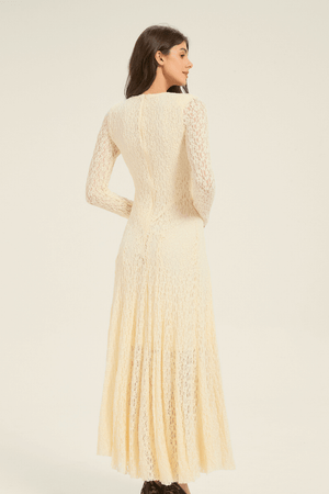 Full-length front view of cream lace long-sleeve maxi dress with flared hemline and feminine V-neck design.