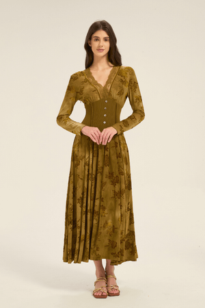 Front view of an olive green floral lace-trim maxi dress with long sleeves, buttoned waist, and flowing hem.