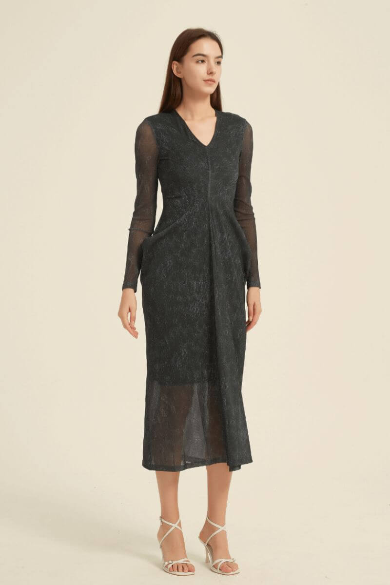 Elegant black midi dress for women featuring a sheer mesh overlay, V-neckline, fitted waist, and flowy semi-transparent hem.