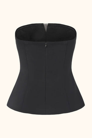 A black strapless corset top shown from the back, featuring a smooth fitted silhouette and clean tailoring against a neutral background.