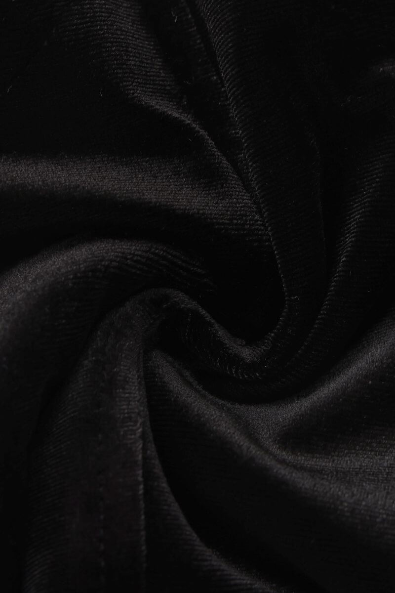 Close-up image of soft black velvet fabric showing its smooth, luxurious texture and subtle sheen, used for Sioéne’s velvet corset top.