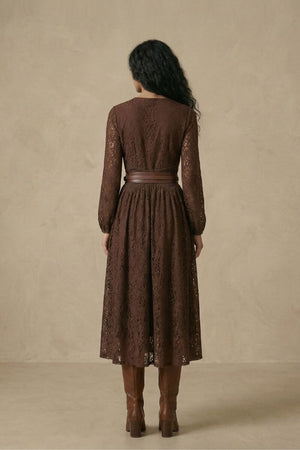 A woman shown from the back wearing a brown lace long-sleeve midi dress featuring a flared skirt and a structured brown leather waist belt.