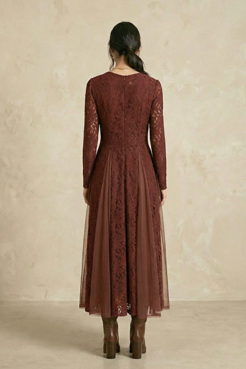 A back view of a burgundy lace midi dress showing the fitted bodice, long lace sleeves, and layered semi-sheer skirt with elegant movement.