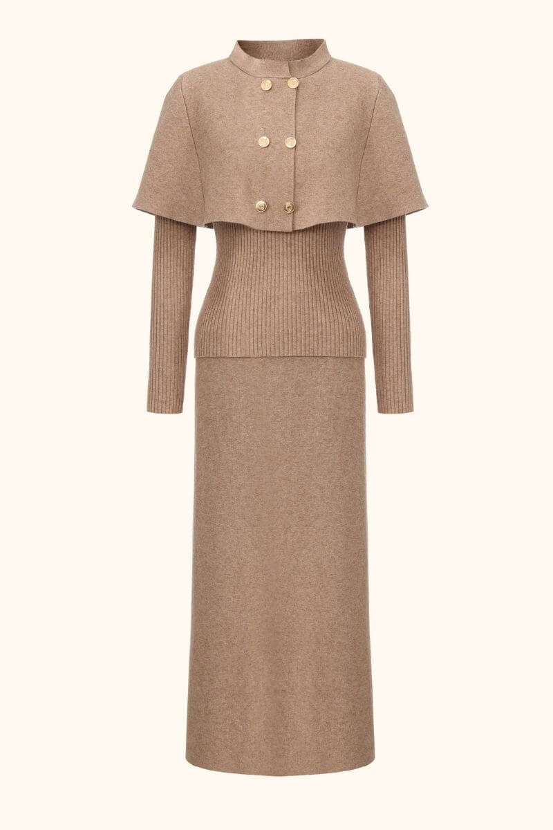 Front view of a camel knit two-piece set featuring a structured cape sweater with gold buttons and a matching ribbed-waist maxi skirt.