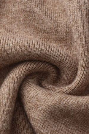 Close-up detail of soft camel ribbed knit fabric showing texture and weave for the sweater and skirt set.