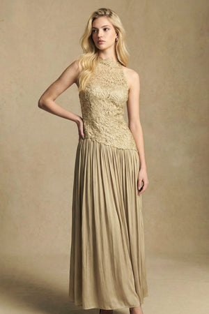Model posing in a gold lace halter-neck midi dress, emphasizing the elegant side silhouette, fitted waist, and softly pleated skirt.