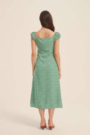 Back view of green ditsy-floral midi dress with square back and cap sleeves