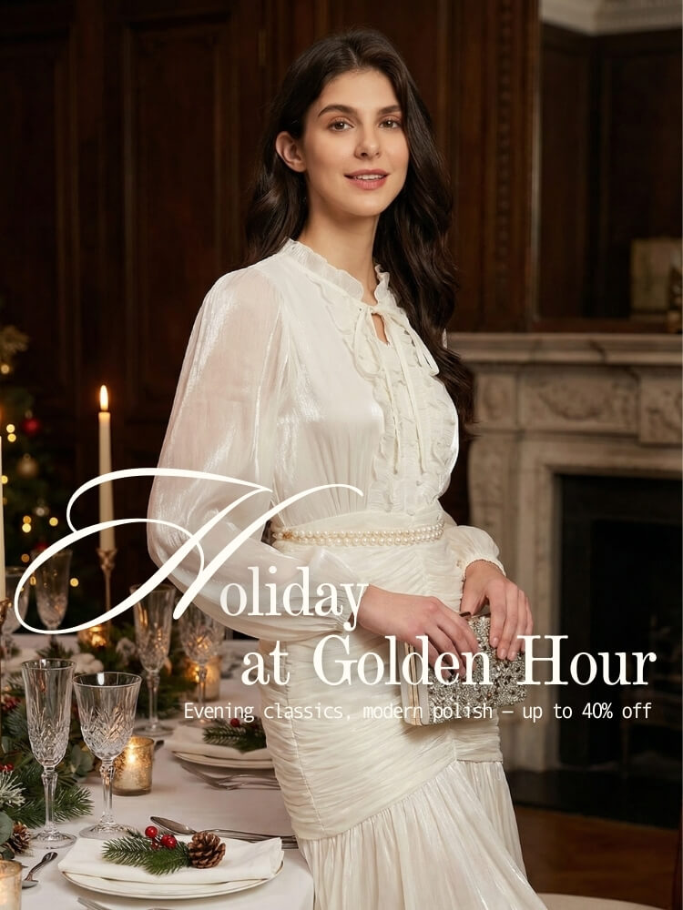 A woman in a white satin ruffle dress holding a crystal clutch at a festive holiday dinner table with candles and holiday greenery, part of Sioéne’s “Holiday at Golden Hour” mobile campaign.