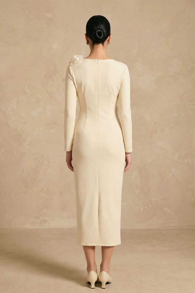 Back view of an ivory long-sleeve midi dress showing a clean silhouette, concealed back zipper, and smooth tailored fit from shoulder to hem.
