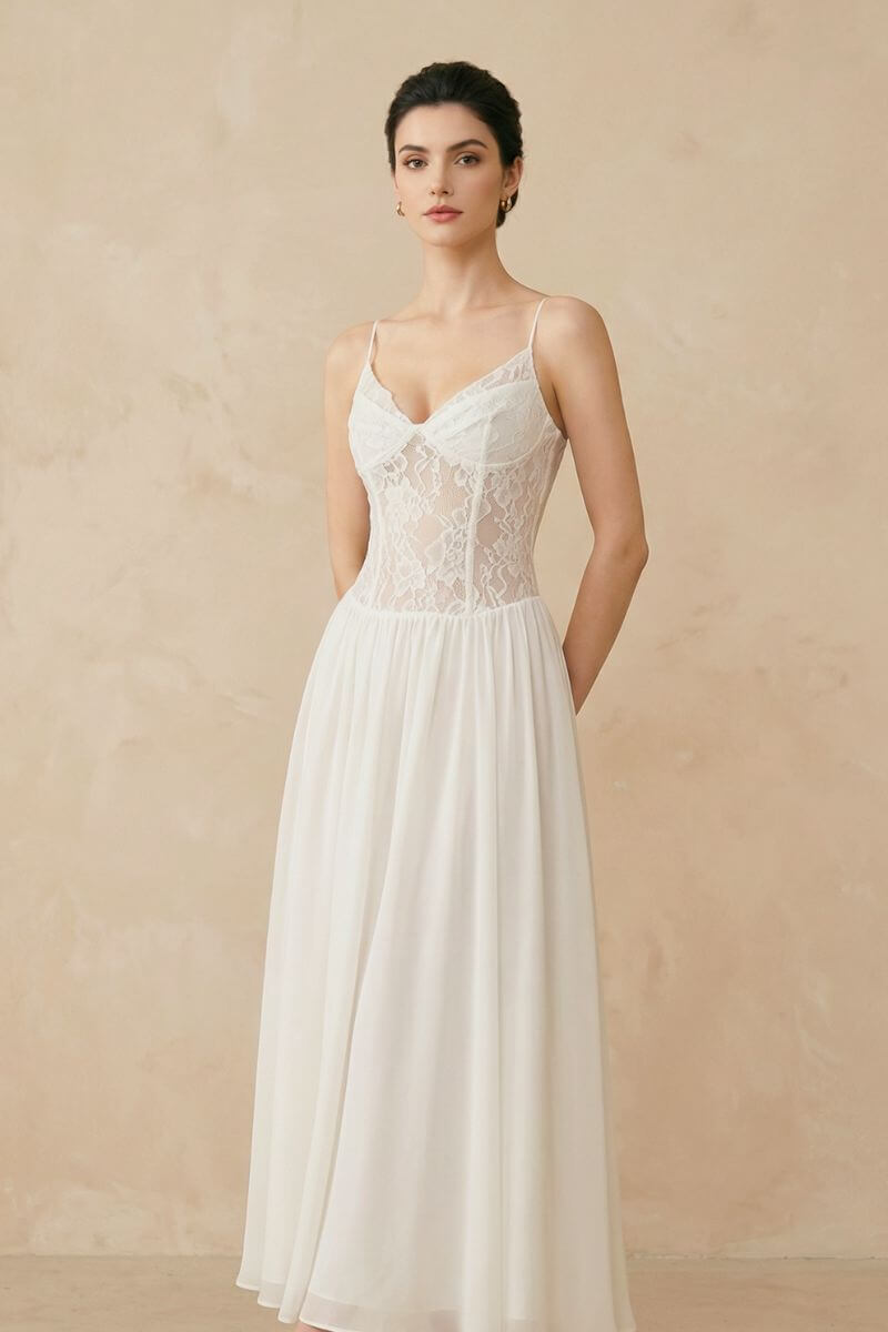 A three-quarter view of an ivory lace corset maxi dress featuring a fitted lace bodice and airy chiffon skirt in a neutral studio setting.