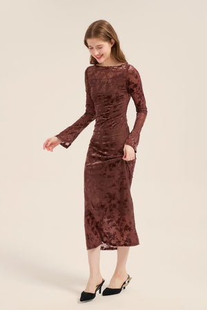 Side view of a mocha velvet midi dress with semi-sheer floral pattern and softly flared cuffs, exuding understated sophistication.