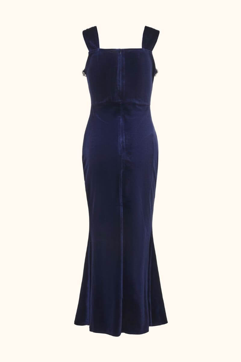 Back view of a navy velvet maxi dress with wide straps and a smooth fitted silhouette, displayed on a plain background.