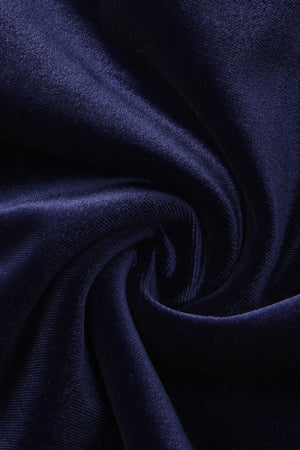 Close-up view of soft navy velvet fabric showing rich sheen and smooth draping texture.