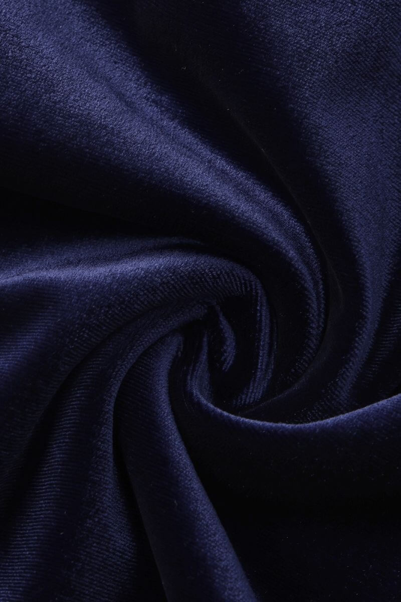 Close-up view of soft navy velvet fabric showing rich sheen and smooth draping texture.