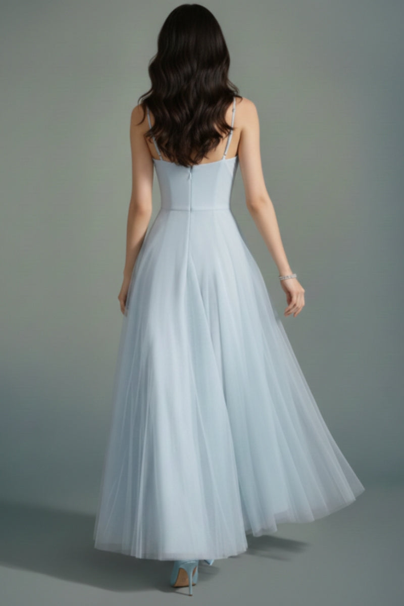 Back view of the powder blue tulle maxi dress showing thin straps, clean back seam, and a softly flowing tulle skirt.