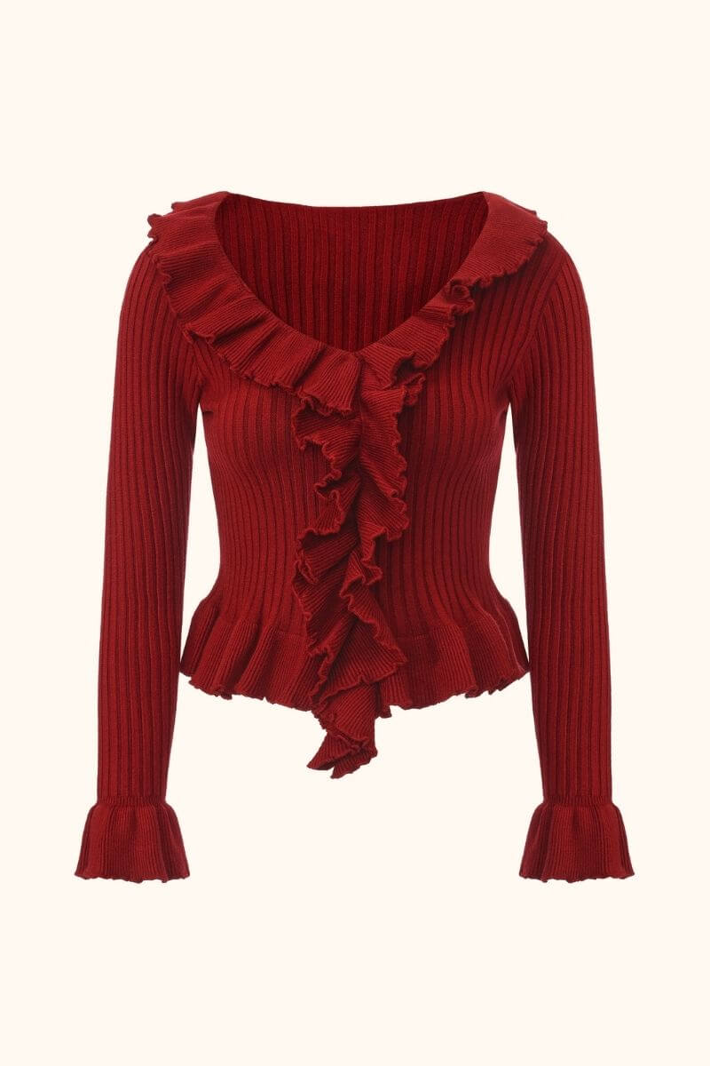 Front view of a red ribbed knit sweater featuring a deep neckline with cascading ruffle trim, long sleeves, and a fitted silhouette.