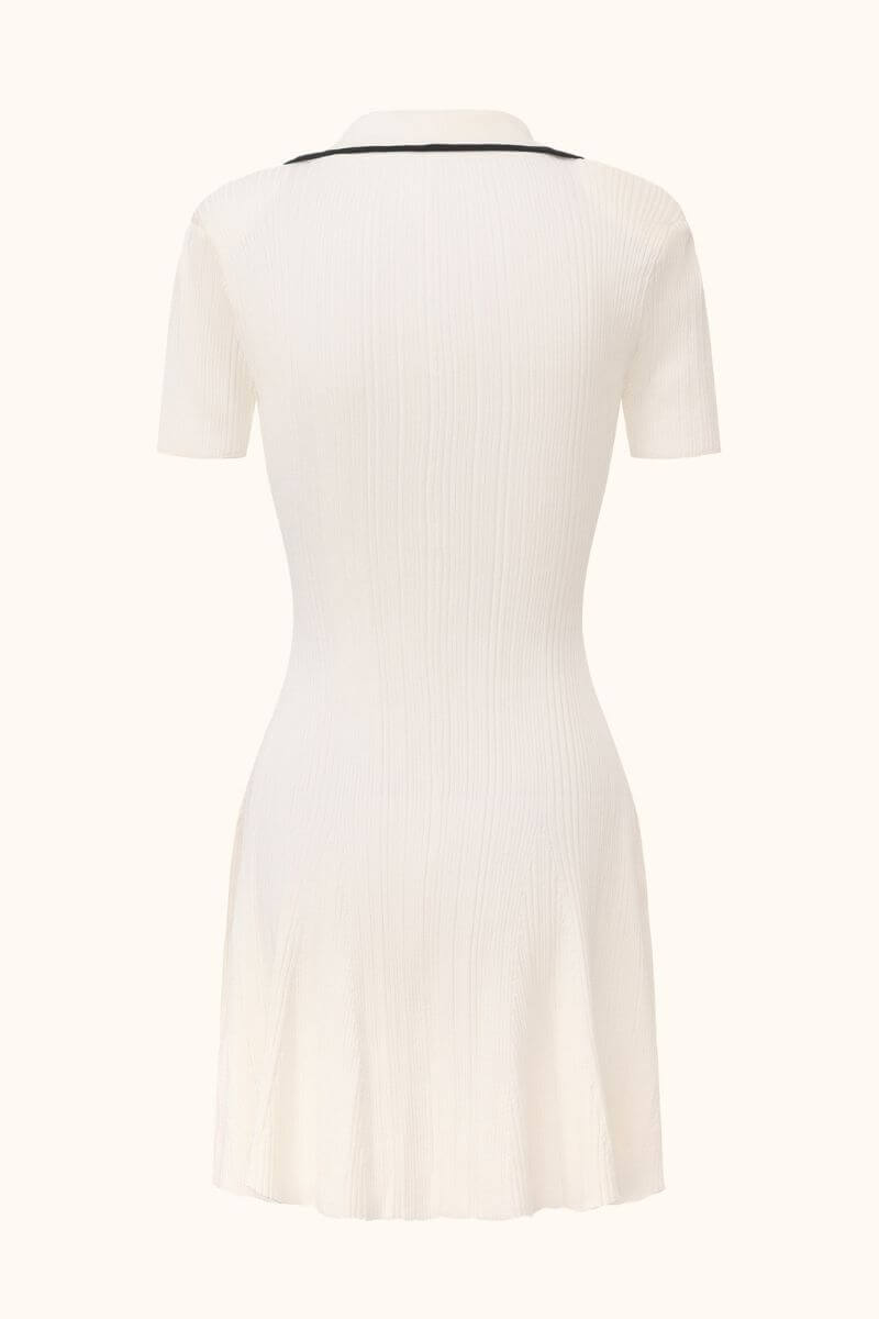 Back view of a white ribbed knit mini dress featuring short sleeves, black collar trim, and a clean, fitted back design.