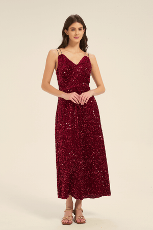 Angled front view of a burgundy sequin maxi dress with double spaghetti straps and shimmering sequin details.