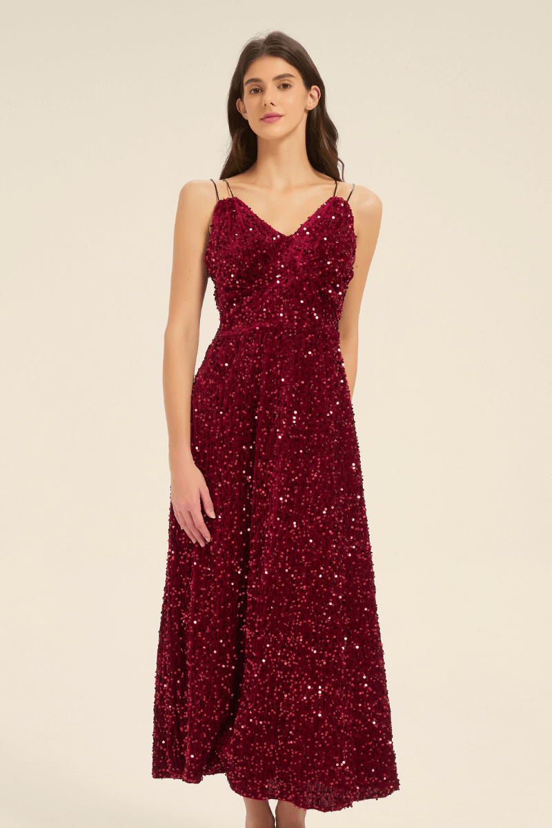 Front view of a burgundy sequin V-neck maxi dress with spaghetti straps, fitted waist, and flowing full-length skirt.