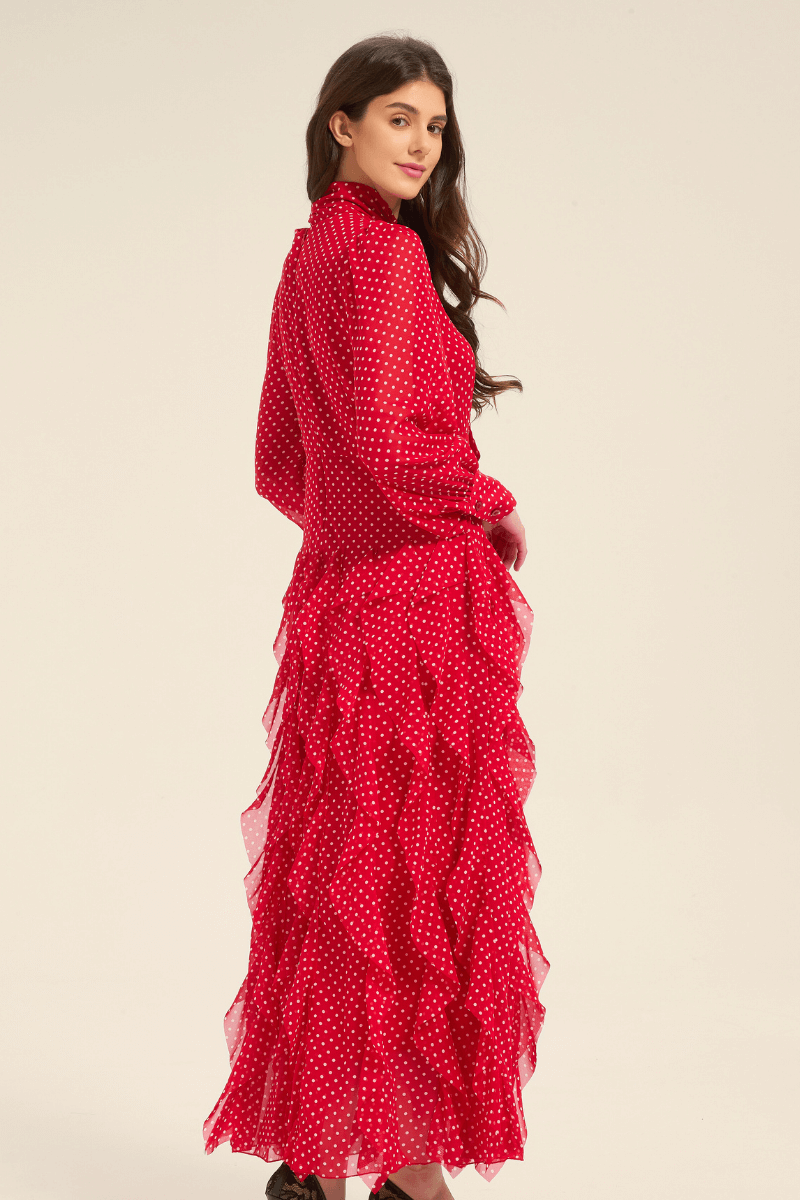 Side view of red polka dot midi dress with cascading ruffles and bow tie collar.