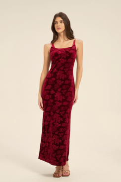 Model wearing a sleeveless red velvet slip dress with rose pattern, front full-length view.