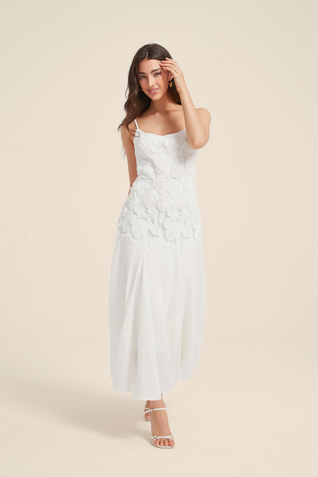 White maxi dress with 3D floral lace bodice and flowy chiffon skirt, featuring delicate straps and a soft romantic silhouette.