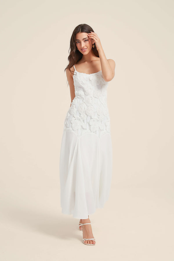 White maxi dress with 3D floral lace bodice and flowy chiffon skirt, featuring delicate straps and a soft romantic silhouette.